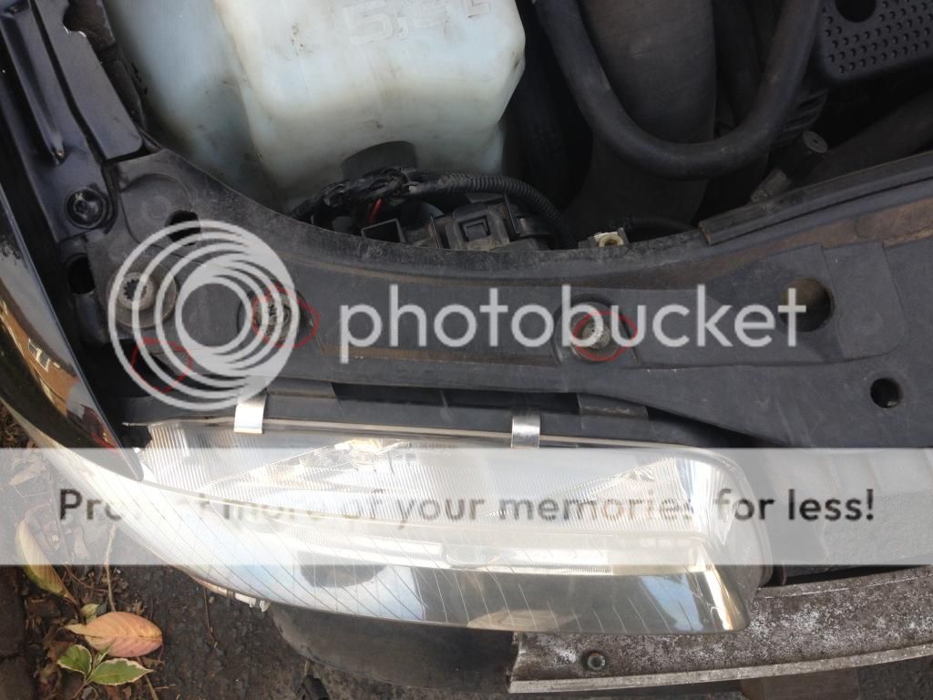 The one down the hole you will need a long screw driver for but it only  needs undoing a few turns before it's loose enough to slide out.